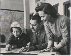 A young Craig Badami in a jet pilot helmet studying maps with his father, Nick, and mother, Avis (who was a licensed pilot). New Jersey – 1958.