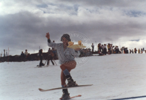 Karen Huntoon delivering drinks on skis while working at Airborne Eddie’s Freestyle Ski Camp at Banff, Alberta, circa 1978.