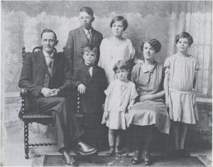 Fletcher family. L to R: Roy (father), Marian (brother), Gladys (sister), Blanche (mother), Bertha (sister); front center: Mel, Juanita (sister), 1924.