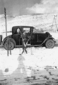 Mel Fletcher and a 1924 Buick at Ecker Hill with his first pair of Drammen metal-edged skis and cable bindings, 1938.