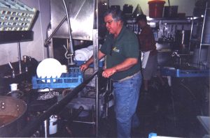 Gary DeSeelhorst washing dishes at the Solitude mid mountain lodge (also called the Roundhouse), 1992.