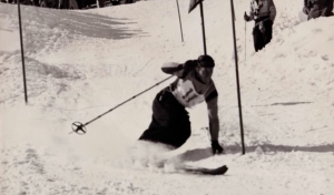Dean participating in a downhill ski race.