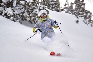 Raelene Davis skis in a Hawaiian shirt as part of a spring campaign at Ski Utah.