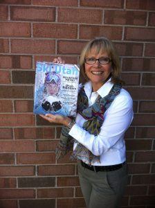 Raelene Davis poses with a Ski Utah magazine.