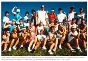 Howard Peterson, center, stands amidst the U.S. national alpine ski team, circa 1990s.